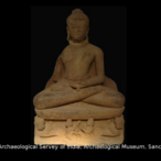 Buddha seated cross legged on a lotus throne